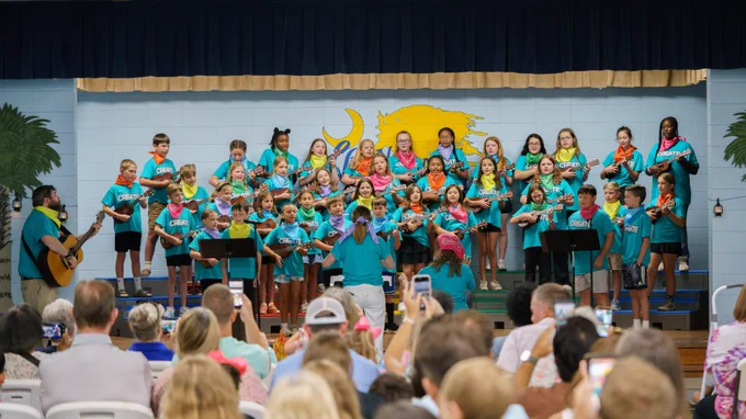 Students singing and playing the ukuleles during the CREATE Program showcase