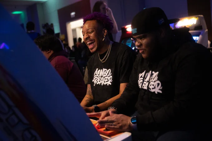 CB2026 commemorative shirt being worn by two players at a candy cab.