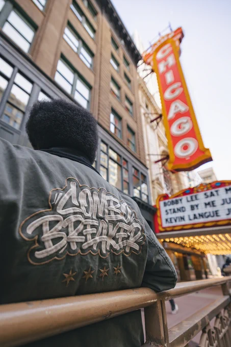 CB2026 Work Jacket in front of Chicago Theatre sign.