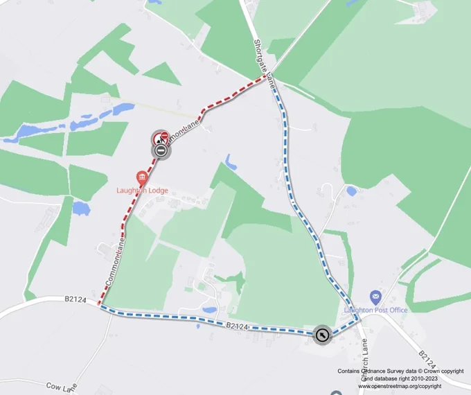 A map displaying two routes between Laughton Lodge and Laughton Post Office. One route is marked in red, traveling south then west, while the other is marked in blue, traveling south then east. Both routes follow B2102 and Station Road. Surrounding areas show greenery and some buildings.