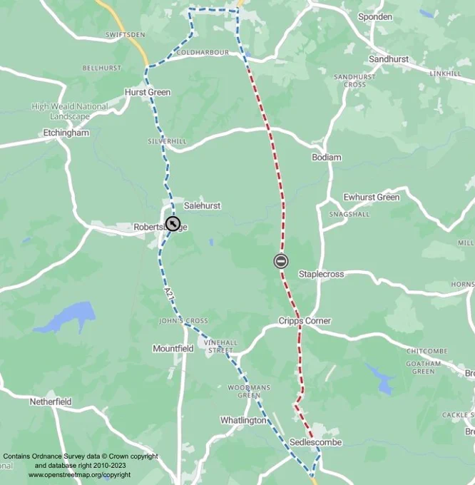 A map showing a route in a rural area with marked paths. The route is depicted with dashed lines: a blue path from Robertsbridge to Bodiam, and a red path from Sedlescombe to Staplecross. The map includes landmarks like Salehurst, Cripps Corner, and Hurst Green, amidst fields and wooded areas.