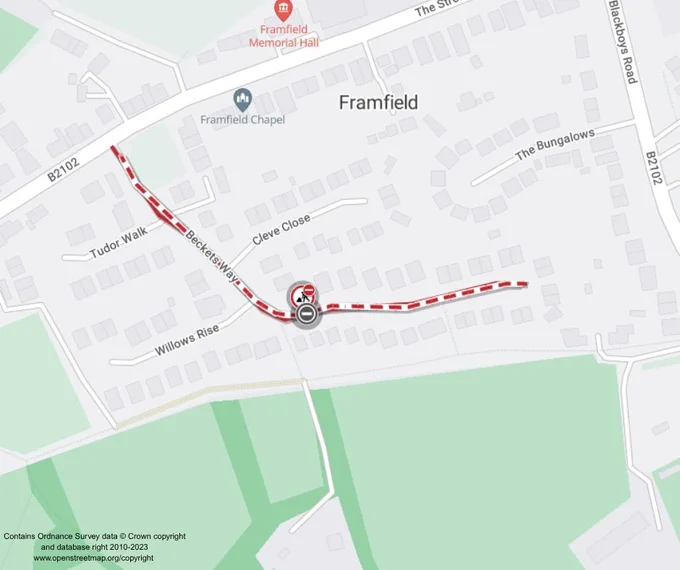 A map showing a section of Framfield, highlighting a planned road closure on Beckett Way with red and white dashed lines. Notable landmarks include Framfield Chapel and Framfield Memorial Hall. Surrounding streets are visible, such as Tudor Walk and Willows Rise.