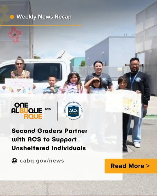 Students and their teacher (center) display signs from their lemonade stand, joined by ACS staff members.