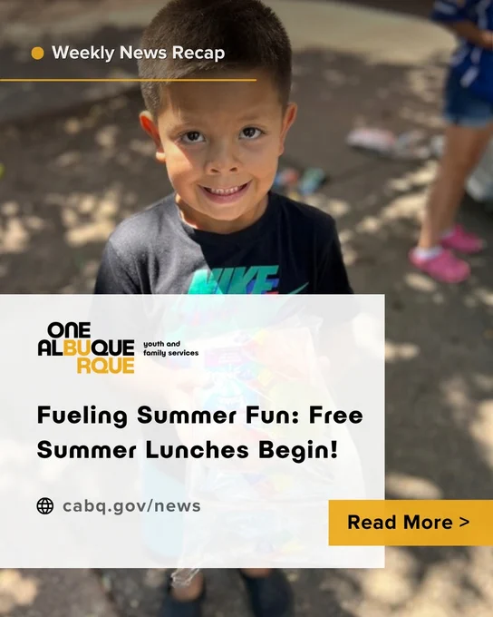 Child with a packaged summer lunch in hand, smiling up at the audience.