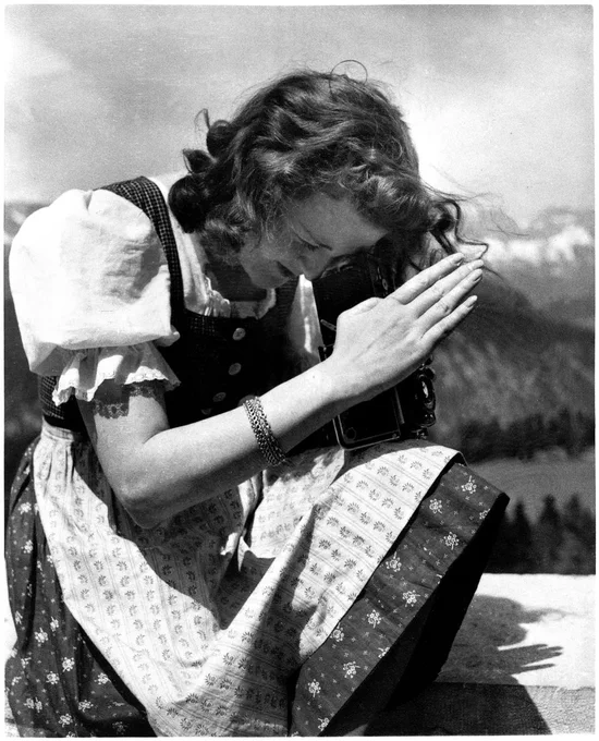 Eva Braun, Hitler's wife, praying.
