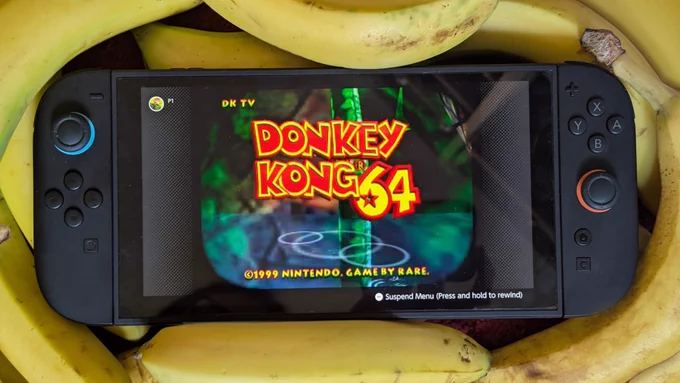 A photo of a Nintendo Switch 2 running Donkey Kong 64, surrounded by bananas. So many bananas. We're now off to look up banana recipes.