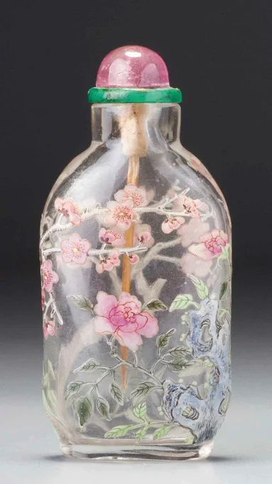 Vintage glass bottle with purple chrysanthemum and cherry blossom motifs.