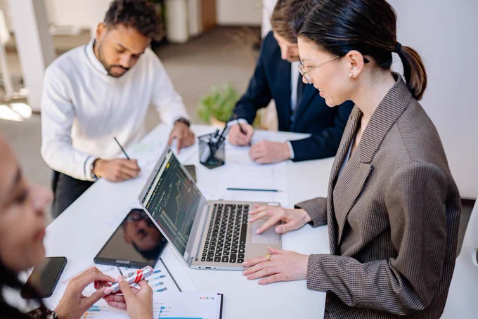 Business team collaborating during a market analysis session.