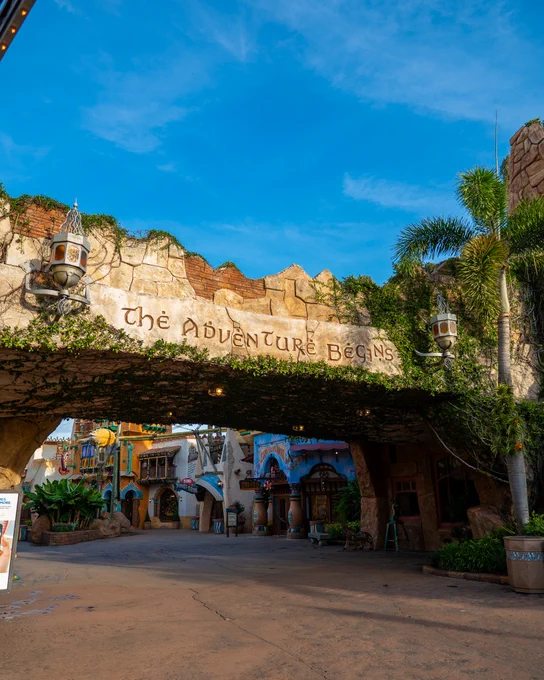 Photo of the \"The Adventure Begins\" sign at Islands of Adventure.