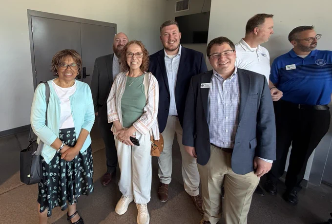 Sen. Spreitzer and Rep. Clint Anderson pose for a picture with local officials.