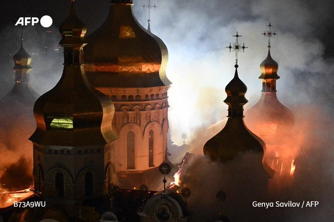 Smoke and fire rises from the Dormition Cathedral in the Orthodox complex of the Kyiv Pechersk Lavra in Ukraine's capital Kyiv on June 15, 2026, following a Russian missile strike amid the Russian invasion in Ukraine