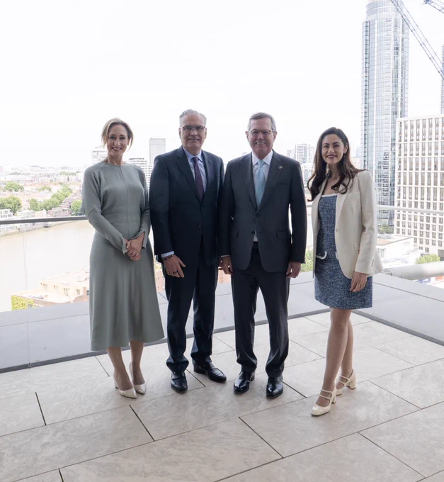 Ambassador Stephens stands with the Haleon team for a group photo.