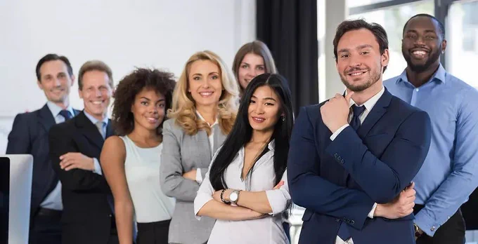 Group of diverse employees posing for a picture depicting an inclusive workforce