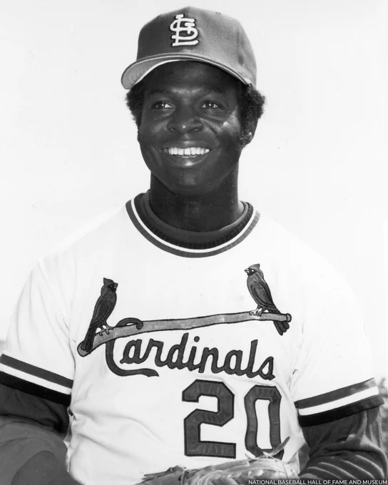 Black and white head and shoulders portrait of Lou Brock in a home white Cardinals uniform. (National Baseball Hall of Fame and Museum)
