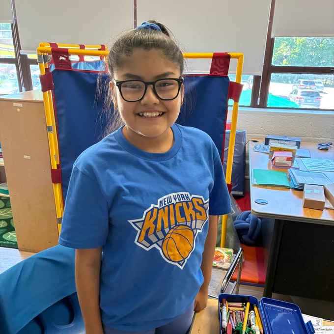 girl in a knicks tee shirt