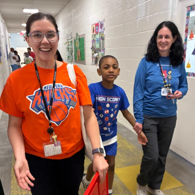 teacher and student with knicks shirt