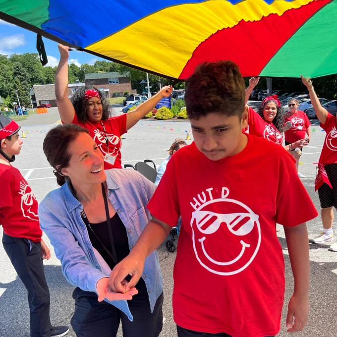 teacher and student play outside on Field Day