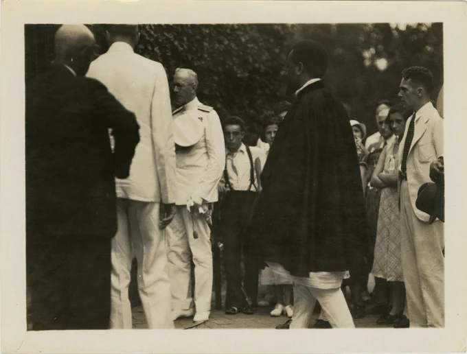 Prince Desta Damtew at Washington's tomb. Resident Superintendent Charles C. Wall stands behind Damtew