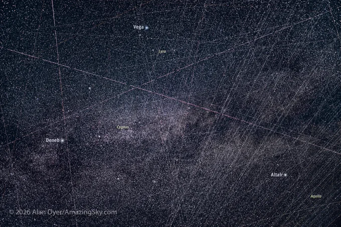 And yes, most of the satellite trails are from SpaceX Starlink satellites as most of the satellites now in orbit are Starlinks. And most seen here are following similar parallel paths as Starlinks sets do. 

For this I stacked just 300 frames out of 1200 I shot this night over 2h30m. Stacking more frames only produced a dense, chaotic mess, with so many satellite trails the stars were hidden behind a wall of bright streaks. 

Technical:
This is a stack of 300 frames, stacked using the program StarStax using the Lighten blend mode, to add the satellite trails rather than average them out.  

Each exposure was 6 seconds at f/1.2 with the Viltrox 35mm LAB lens on the Nikon Z8 at ISO 1600. There was an interval of 1 second between exposures, thus the gaps in all the trails. The camera was on a tracker following the turning sky, so the stars stay fixed on the frame with minimal trailing, and the satellites streak against the point-like stars. 
