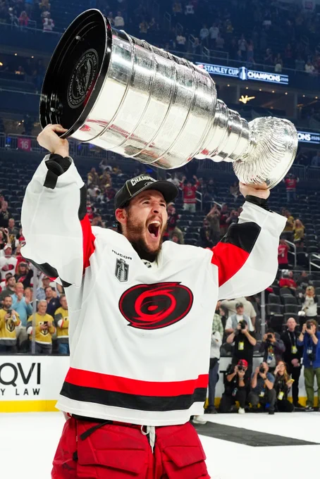 Carolina goalie Brandon Bussi lifts the Stanley Cup in Las Vegas