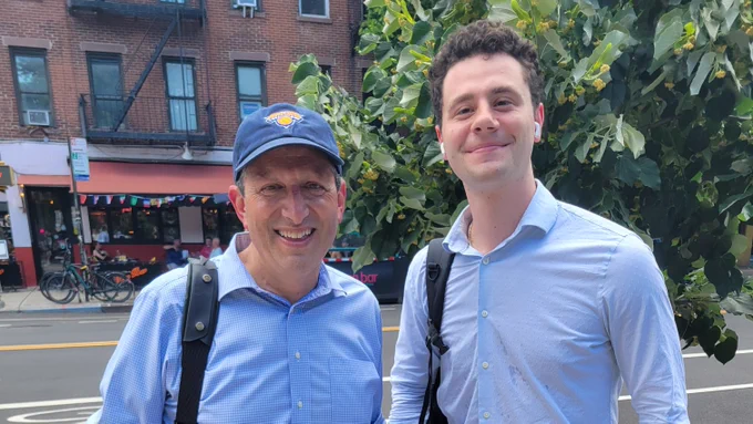 Standing with a neighbor.