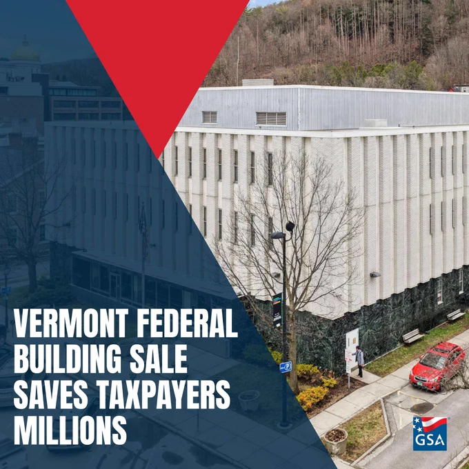 Aerial view of the Vermont Federal Building surrounded by trees and a parking lot with a red car nearby.