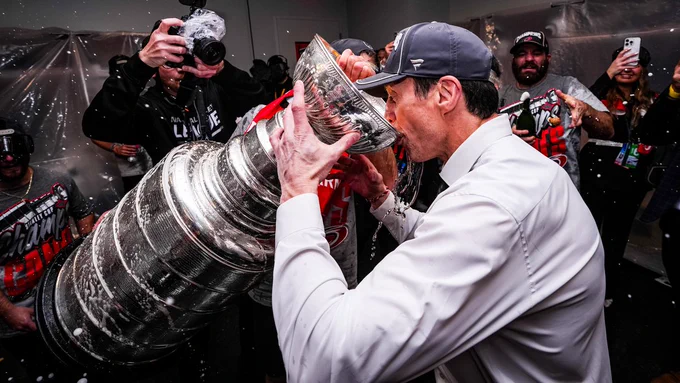 Photo of Rod Brind'Amour drinking out of the Stanley Cup 