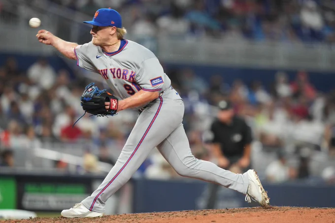 Right-hander Jonathan Pintaro pitches in a grey New York Mets uniform