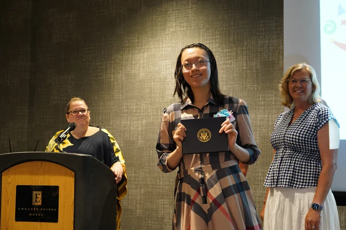 Intern receiving diploma