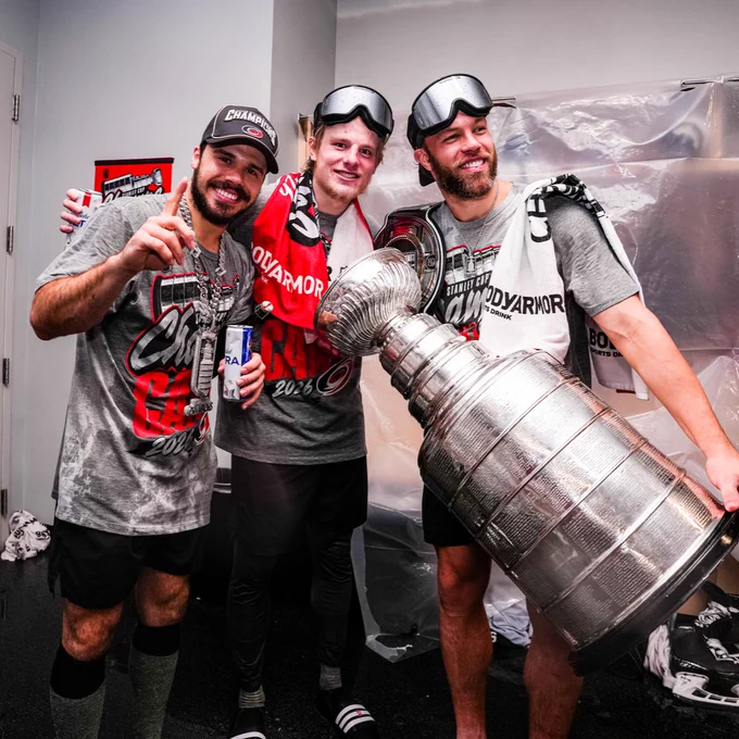 Photo of Logan Stankoven, Jackson Blake, and Taylor Hall posing for a photo with the Stanley Cup