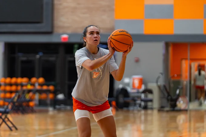 UTRGV women's basketball player prepares to shoot the ball during a team workout.
