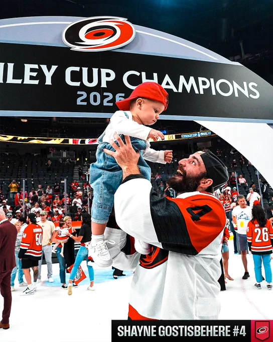 Shayne Gostisbehere with his child during Stanley Cup celebrations.
