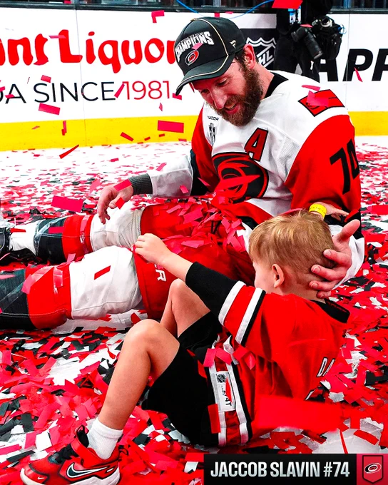 Jaccob Slavin with his child during Stanley Cup celebrations.
