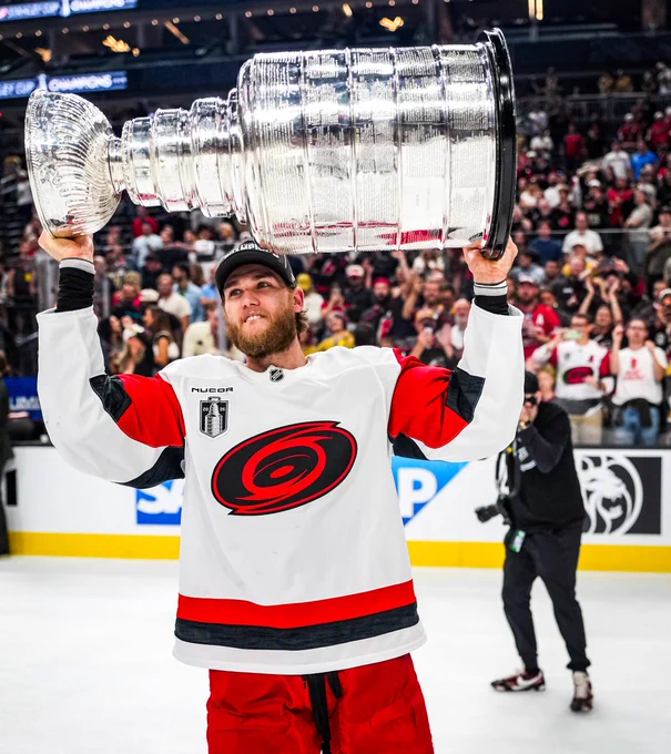 Photo of Mark Jankowski hoisting the Cup 