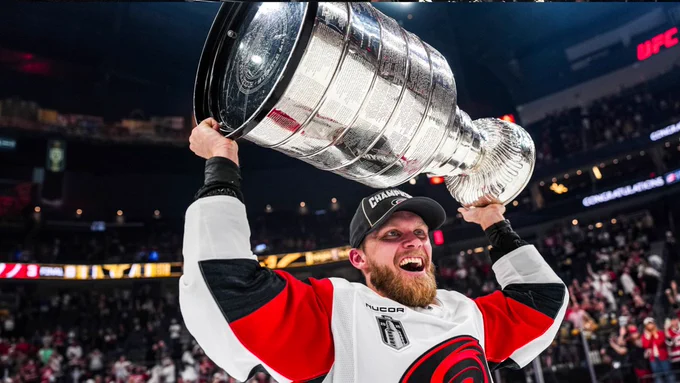 Photo of Nikolaj Ehlers hoisting the Cup 