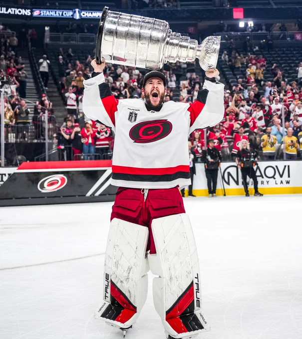 Photo of Brandon Bussi hoisting the Cup