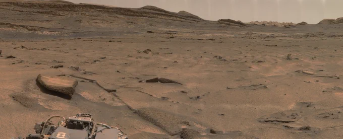 An ochre toned image capturing the Martian landscape on the slopes of Aeolis Mons in Gale Crater. The Yardang Unit shows as the lighter toned features at the top to the right. June 13, 2026, Sol 4924. Credit: NASA/JPL-Caltech/MSSS/fredk