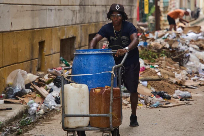A man pushes a cart of empty containers to fill with water in Havana, Cuba, Friday, June 12, 2026 (AP Photo / Ramon Espinosa)