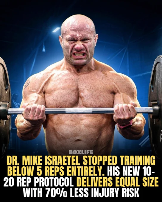 A muscular man lifts a barbell with focus and intensity in a gym setting. The image promotes a high-repetition workout protocol for size and reduced injury risk.