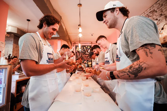 Jatee Kearsley instructs Yankees players and coaches on how to bake while at her Bed-Stuy bakery, Je T’aime Pâtisserie. 