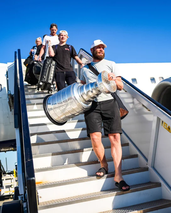Photo of Jordan Staal getting off the plane in Raleigh with the Stanley Cup 