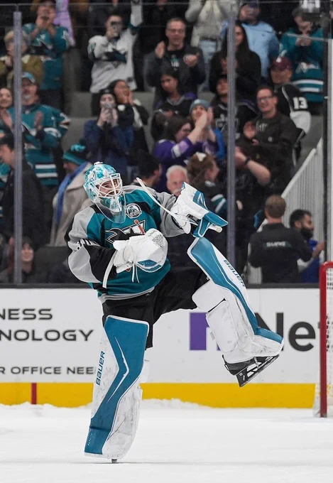 Yaroslav Askarov celebrating after a win in the Sharks heritage 2.0 jersey