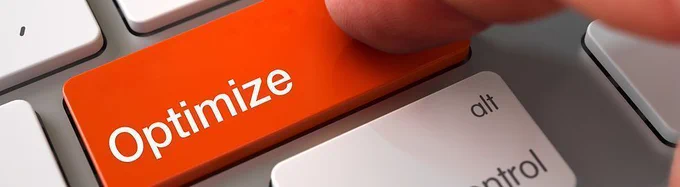 Computer Keyboard button in a bright orange colour with the word 'Optimize' written in white