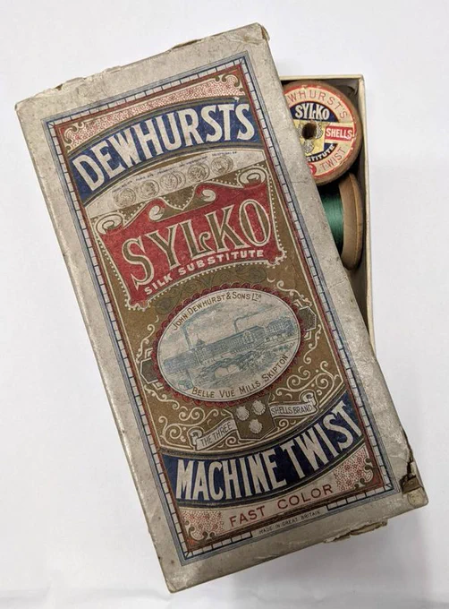 Vintage Dewhursts Sylko Machine Twist sewing thread box with spools inside.