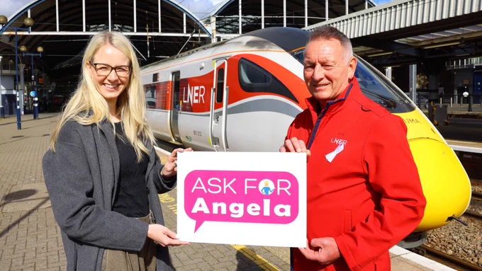 LNER Customer Nicola and LNER Safety and Safeguarding Manager Jim Rawcliffe standing in front of an LNER Azuma train at Newcastle