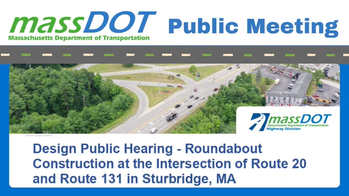 Aerial view of a busy roundabout at the intersection of Route 20 and Route 131 in Sturbridge, MA, with surrounding greenery and parking lots.