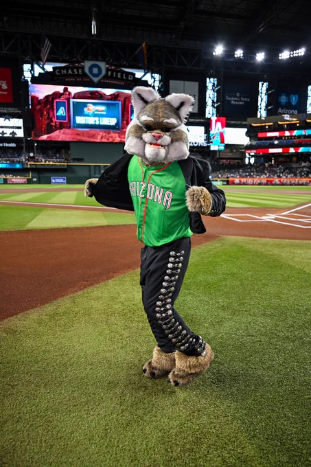 Baxter shows off his Mexican Heritage Night jersey on the field during pregame.