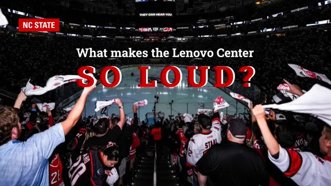 Crowd at Lenovo Center waving towels and cheering at a Carolina Hurricanes game. NC State logo in top left. Text says "What makes the Lenovo Center so loud?"