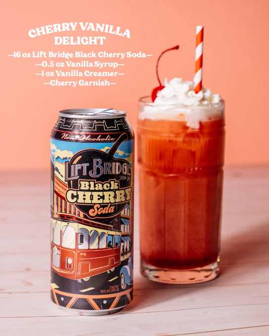 A refreshing Cherry Vanilla Delight drink featuring Lift Bridge Black Cherry Soda, vanilla syrup, and a cherry garnish. The setup is playful with vibrant colors and a retro soda can.