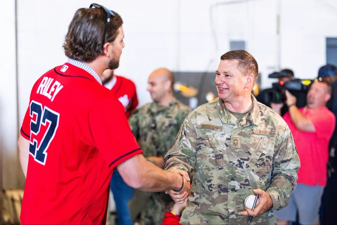 Austin Riley greets a military member